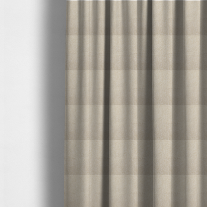 The fabric used to create these made-to-measure curtains is a Chamonix Water Repellent upholstery fabric in Cream. The material features a dense, multi-tonal basket weave texture with warm ivory and off-white threads and a durable, matte finish.