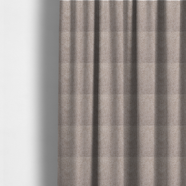 The fabric used to create these made-to-measure curtains is a Chamonix Water Repellent upholstery fabric in light brown. The material features a dense basket weave texture with oatmeal and cream tones and a durable, matte finish.