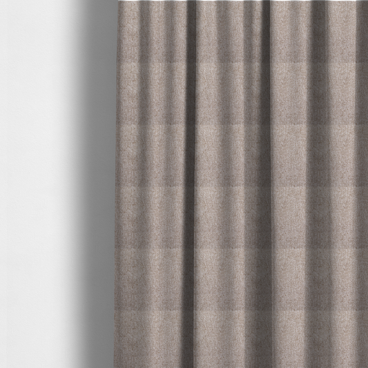 The fabric used to create these made-to-measure curtains is a Chamonix Water Repellent upholstery fabric in light brown. The material features a dense basket weave texture with oatmeal and cream tones and a durable, matte finish.