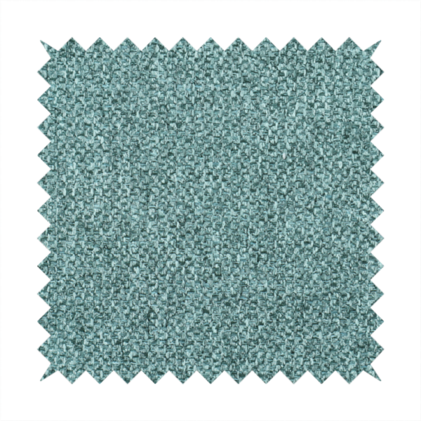A Chamonix Water Repellent upholstery fabric in Emerald Green. The material features a dense, jewel-toned basket weave texture with a multi-tonal finish and a durable, matte look.