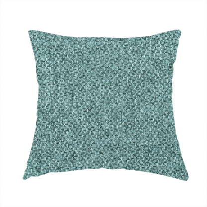 The fabric used to create these handmade cushions is a Chamonix Water Repellent upholstery fabric in Emerald Green. The material features a dense, jewel-toned basket weave texture with a multi-tonal finish and a durable, matte look.