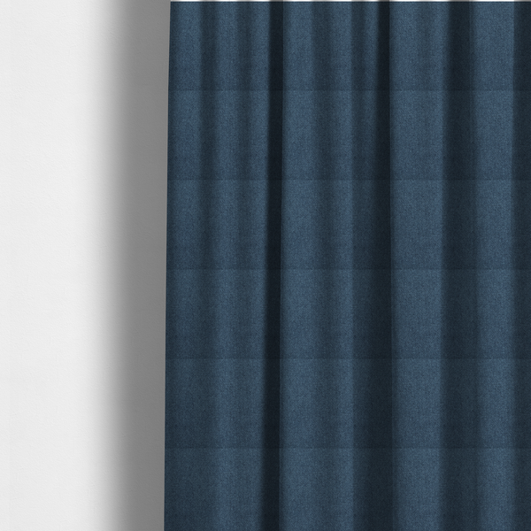 the fabric used to create these made-to-measure curtains is a Chamonix Water Repellent upholstery fabric in Navy Blue. The material features a dense, multi-tonal indigo basket weave texture with a durable, matte finish.