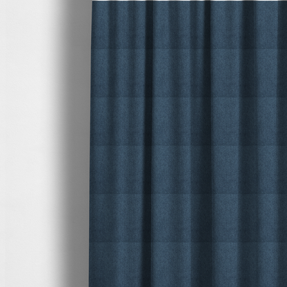 the fabric used to create these made-to-measure curtains is a Chamonix Water Repellent upholstery fabric in Navy Blue. The material features a dense, multi-tonal indigo basket weave texture with a durable, matte finish.