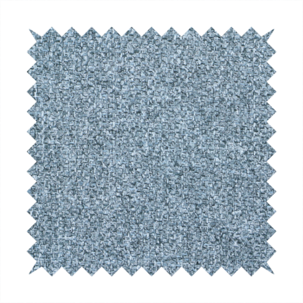 A Chamonix Water Repellent upholstery fabric in Denim Blue. The material features a dense, multi-tonal basket weave texture with blue and grey threads and a durable, matte finish.
