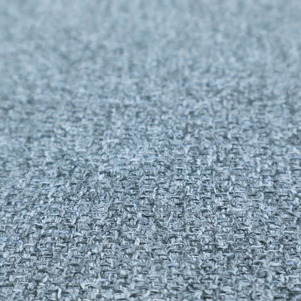 A Chamonix Water Repellent upholstery fabric in Denim Blue. The material features a dense, multi-tonal basket weave texture with blue and grey threads and a durable, matte finish.
