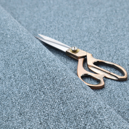 A Chamonix Water Repellent upholstery fabric in Denim Blue. The material features a dense, multi-tonal basket weave texture with blue and grey threads and a durable, matte finish.