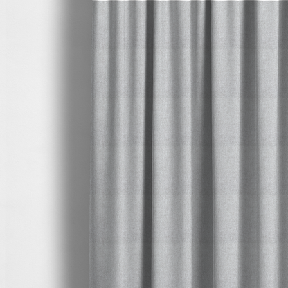 The fabric used to create these made-to-measure curtains is a Chamonix Water Repellent upholstery fabric in Silver. A clean, light-grey basket weave texture with a subtle effect and a sophisticated matte finish.