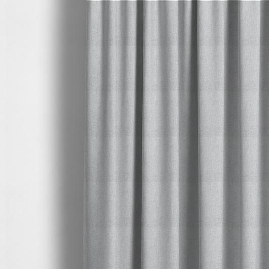 The fabric used to create these made-to-measure curtains is a Chamonix Water Repellent upholstery fabric in Silver. A clean, light-grey basket weave texture with a subtle effect and a sophisticated matte finish.