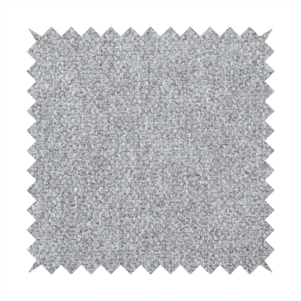 This weathered fabric blends charcoal and slate yarns with cool silver and off-white threads, resulting in a balanced, stony neutral that offers a modern and professional aesthetic.