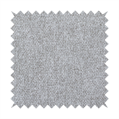 This weathered fabric blends charcoal and slate yarns with cool silver and off-white threads, resulting in a balanced, stony neutral that offers a modern and professional aesthetic.