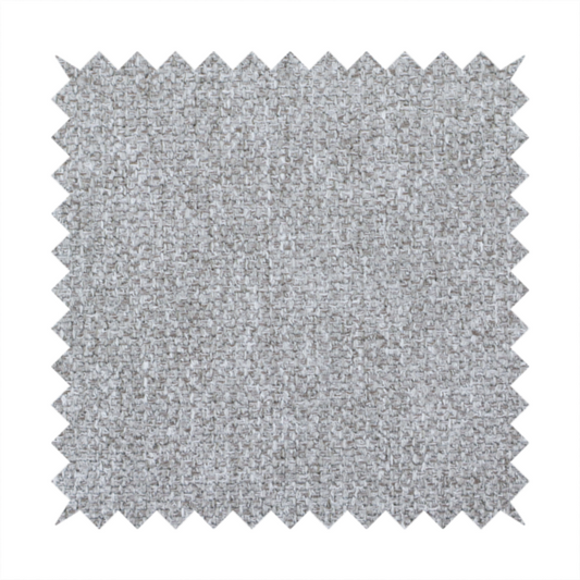 This weathered fabric blends charcoal and slate yarns with cool silver and off-white threads, resulting in a balanced, stony neutral that offers a modern and professional aesthetic.