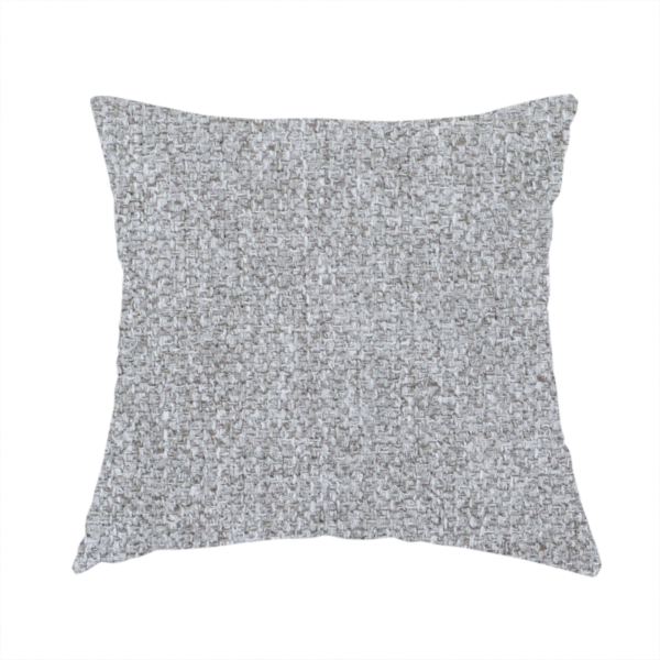 The fabric used to create this handmade cushion is a weathered fabric blends charcoal and slate yarns with cool silver and off-white threads, resulting in a balanced, stony neutral that offers a modern and professional aesthetic.