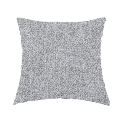 The fabric used to create this handmade cushion is a weathered fabric blends charcoal and slate yarns with cool silver and off-white threads, resulting in a balanced, stony neutral that offers a modern and professional aesthetic.