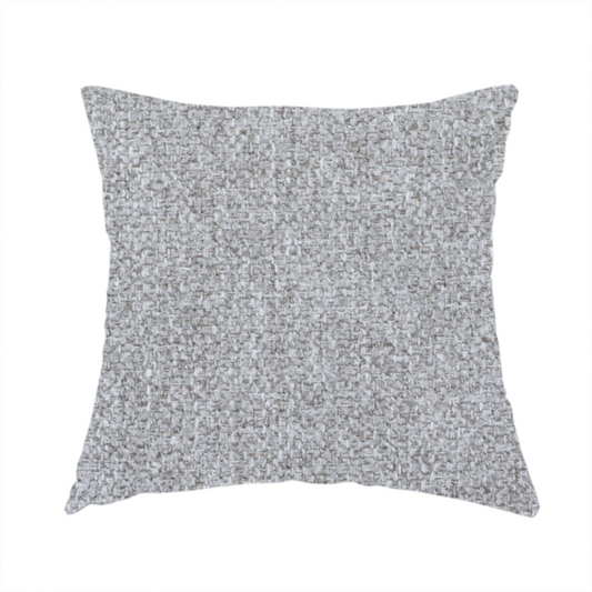 The fabric used to create this handmade cushion is a weathered fabric blends charcoal and slate yarns with cool silver and off-white threads, resulting in a balanced, stony neutral that offers a modern and professional aesthetic.