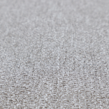 This weathered fabric blends charcoal and slate yarns with cool silver and off-white threads, resulting in a balanced, stony neutral that offers a modern and professional aesthetic.