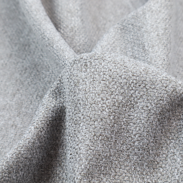 This weathered fabric blends charcoal and slate yarns with cool silver and off-white threads, resulting in a balanced, stony neutral that offers a modern and professional aesthetic.
