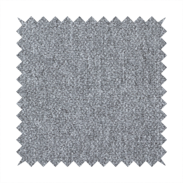 A versatile Mid Grey. This fabric features a classic "salt and pepper" effect, blending charcoal and light silver threads for a balanced, stony appearance that hides wear exceptionally well.