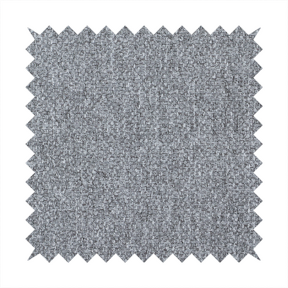 A versatile Mid Grey. This fabric features a classic "salt and pepper" effect, blending charcoal and light silver threads for a balanced, stony appearance that hides wear exceptionally well.