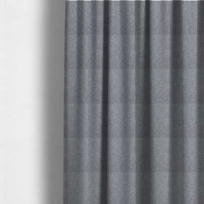 The fabric used to create these made-to-measure curtains is a versatile Mid Grey. This fabric features a classic "salt and pepper" effect, blending charcoal and light silver threads for a balanced, stony appearance that hides wear exceptionally well.