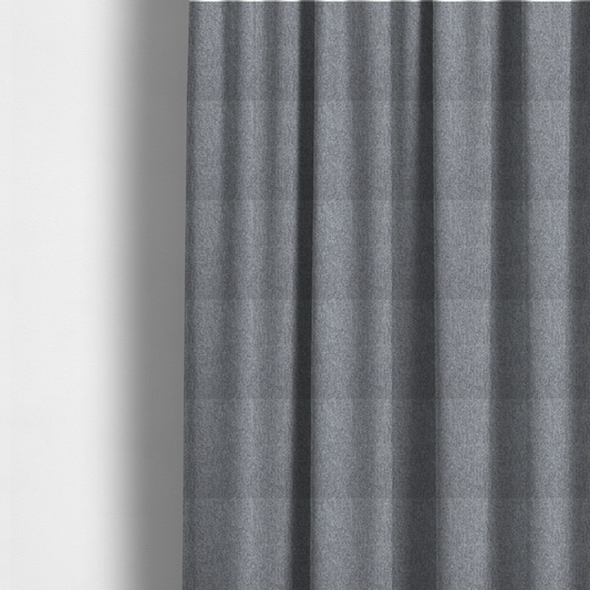 The fabric used to create these made-to-measure curtains is a versatile Mid Grey. This fabric features a classic "salt and pepper" effect, blending charcoal and light silver threads for a balanced, stony appearance that hides wear exceptionally well.