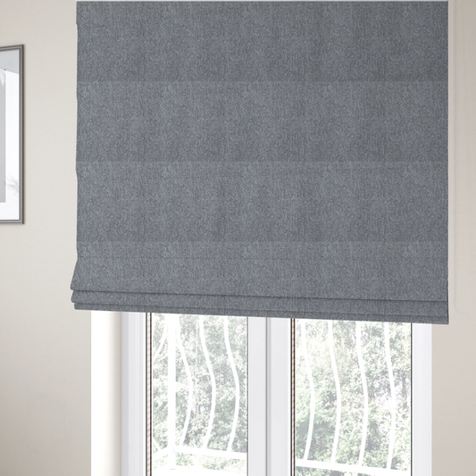 the fabric used to create these Roman blinds is a versatile Mid Grey. This fabric features a classic "salt and pepper" effect, blending charcoal and light silver threads for a balanced, stony appearance that hides wear exceptionally well.