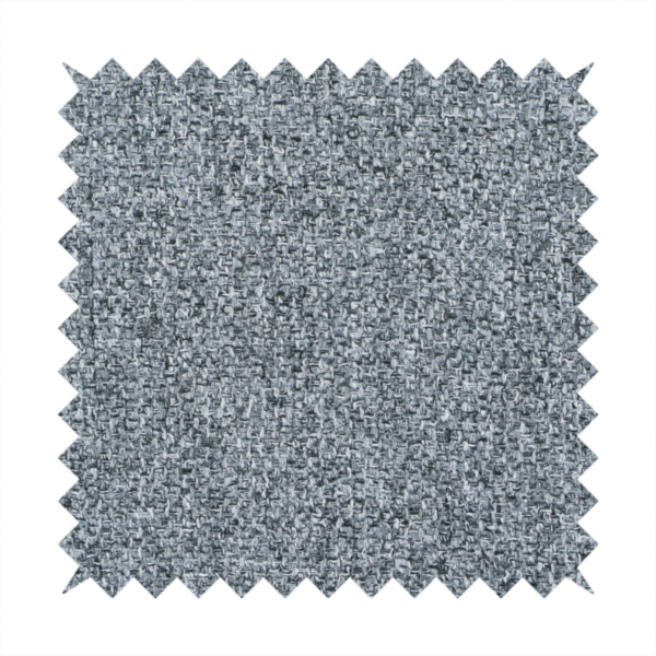 A cool, industrial Steel Grey. This fabric features a high-contrast effect, interlacing charcoal, silver, and bright white threads to create a crisp, textured look that mimics the appearance of salt-and-pepper granite.