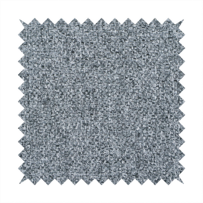 A cool, industrial Steel Grey. This fabric features a high-contrast effect, interlacing charcoal, silver, and bright white threads to create a crisp, textured look that mimics the appearance of salt-and-pepper granite.