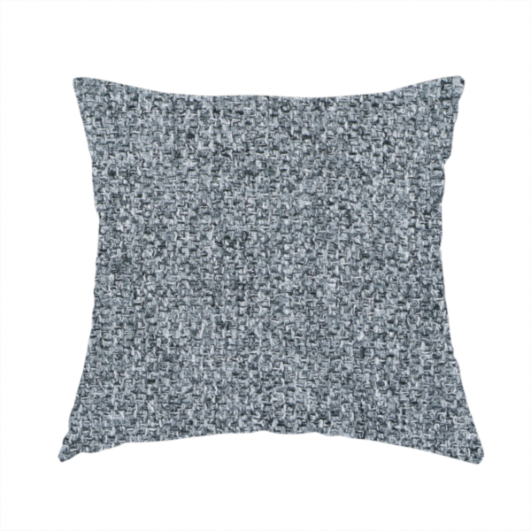 The fabric used to create this handmade cushion is a cool, industrial Steel Grey. This fabric features a high-contrast effect, interlacing charcoal, silver, and bright white threads to create a crisp, textured look that mimics the appearance of salt-and-pepper granite.