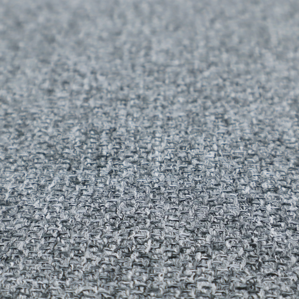 A cool, industrial Steel Grey. This fabric features a high-contrast effect, interlacing charcoal, silver, and bright white threads to create a crisp, textured look that mimics the appearance of salt-and-pepper granite.