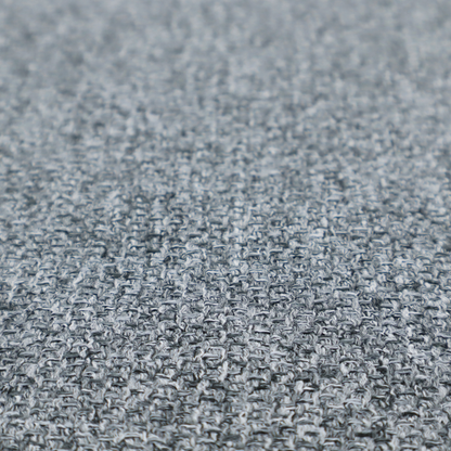 A cool, industrial Steel Grey. This fabric features a high-contrast effect, interlacing charcoal, silver, and bright white threads to create a crisp, textured look that mimics the appearance of salt-and-pepper granite.