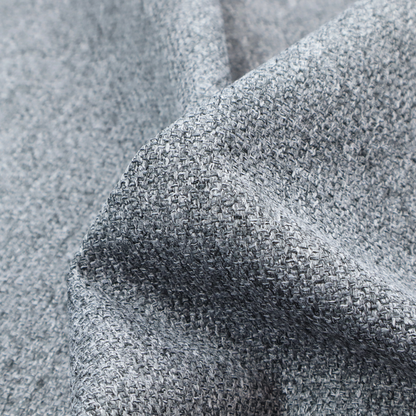 A cool, industrial Steel Grey. This fabric features a high-contrast effect, interlacing charcoal, silver, and bright white threads to create a crisp, textured look that mimics the appearance of salt-and-pepper granite.