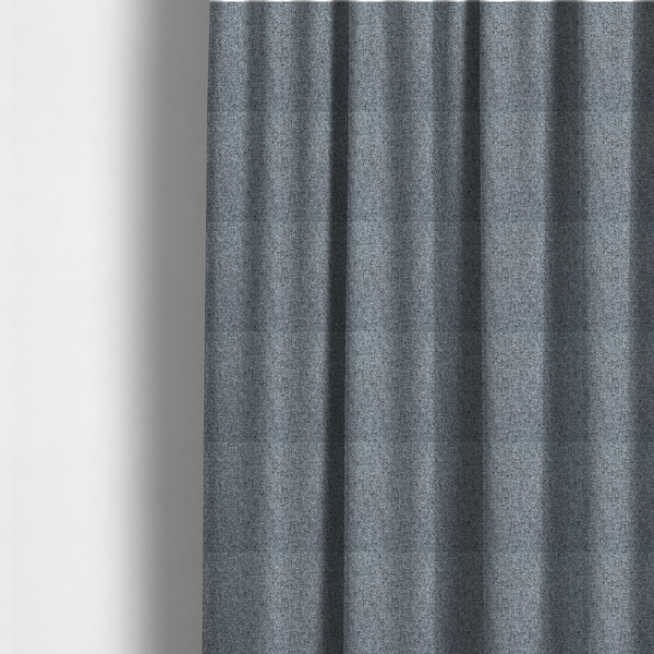 The fabric used to create these made-to-measure curtains is a cool, industrial Steel Grey. This fabric features a high-contrast effect, interlacing charcoal, silver, and bright white threads to create a crisp, textured look that mimics the appearance of salt-and-pepper granite.