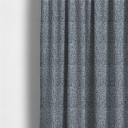 The fabric used to create these made-to-measure curtains is a cool, industrial Steel Grey. This fabric features a high-contrast effect, interlacing charcoal, silver, and bright white threads to create a crisp, textured look that mimics the appearance of salt-and-pepper granite.