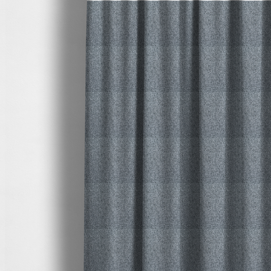 The fabric used to create these made-to-measure curtains is a cool, industrial Steel Grey. This fabric features a high-contrast effect, interlacing charcoal, silver, and bright white threads to create a crisp, textured look that mimics the appearance of salt-and-pepper granite.