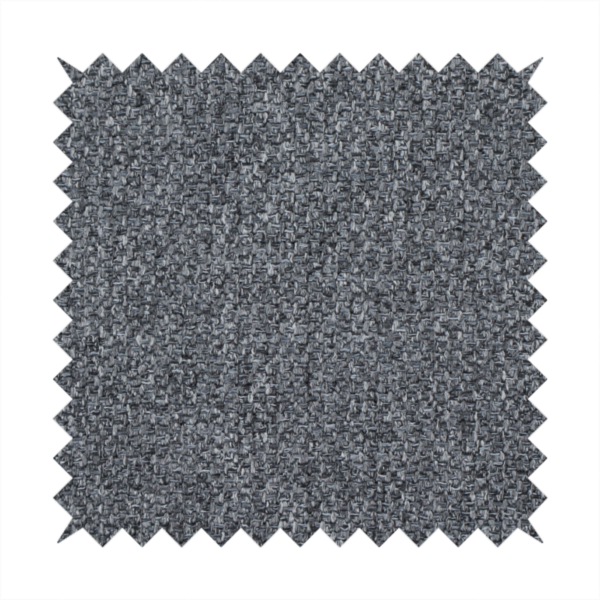 A deep, dramatic Charcoal Grey. This fabric features a high-density basket weave that blends dark soot tones with flecks of slate and silver. The tight, pebbled texture gives the dark colour a sophisticated, matte architectural feel.