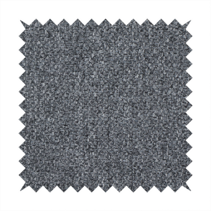 A deep, dramatic Charcoal Grey. This fabric features a high-density basket weave that blends dark soot tones with flecks of slate and silver. The tight, pebbled texture gives the dark colour a sophisticated, matte architectural feel.