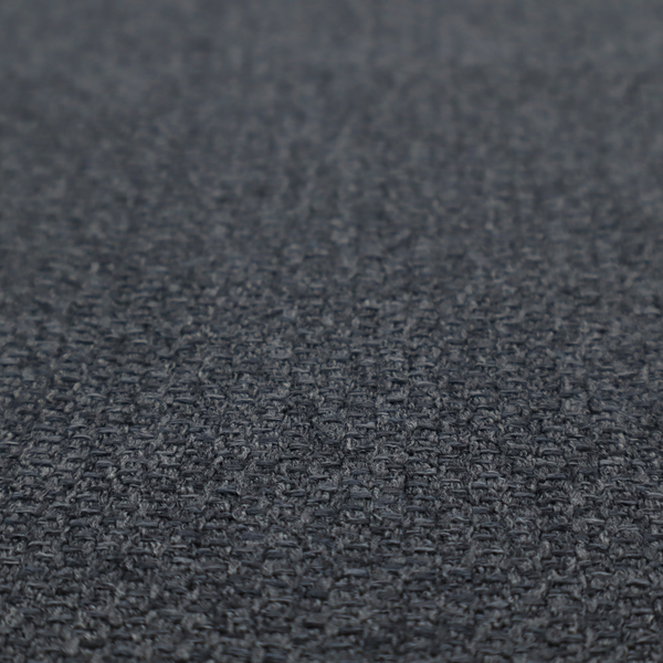 A deep, obsidian Black. Unlike a flat solid, this fabric uses a dense basket weave to create a rich, textured surface. The interlacing yarns catch the light in a way that provides a soft charcoal sheen, adding depth to the dark palette.