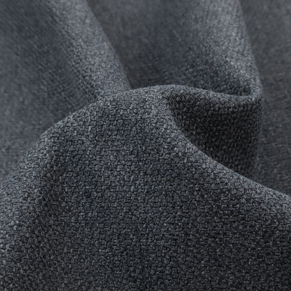 A deep, obsidian Black. Unlike a flat solid, this fabric uses a dense basket weave to create a rich, textured surface. The interlacing yarns catch the light in a way that provides a soft charcoal sheen, adding depth to the dark palette.