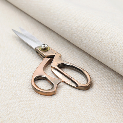 A light beige woven fabric with a subtle, textured grid pattern.