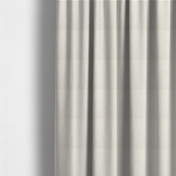 The fabric used to create these made-to-measure curtains is a light beige woven fabric with a subtle, textured grid pattern.