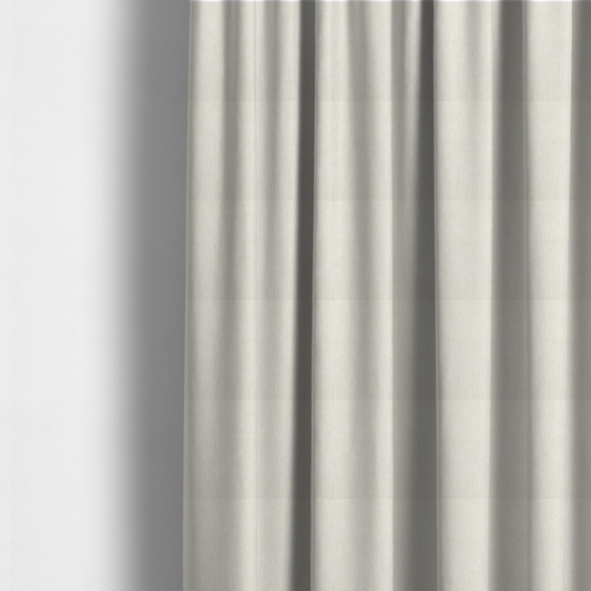 The fabric used to create these made-to-measure curtains is a light beige woven fabric with a subtle, textured grid pattern.