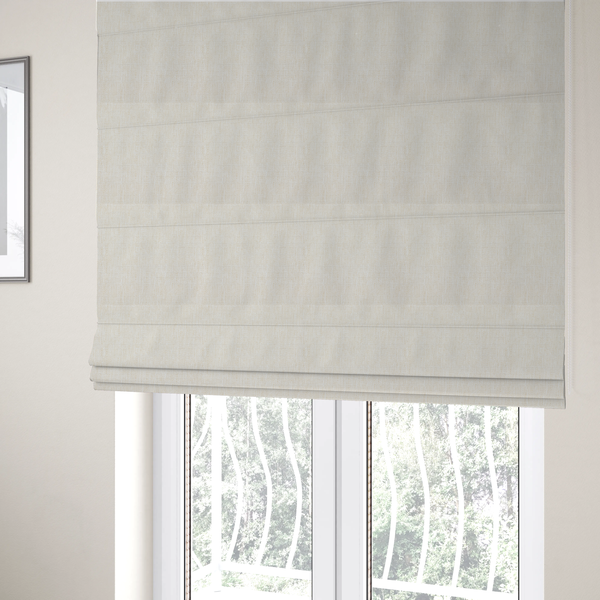 The fabric used to create these Roman blinds is a light beige woven fabric with a subtle, textured grid pattern.