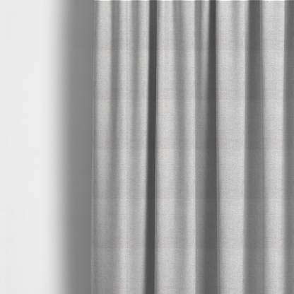 The fabric used to create these made-to-measure curtains is a marl grey woven fabric with a heathered, multi-tonal textured finish.