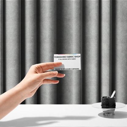 The fabric used to create these made-to-measure curtains is a marl grey woven fabric with a heathered, multi-tonal textured finish.