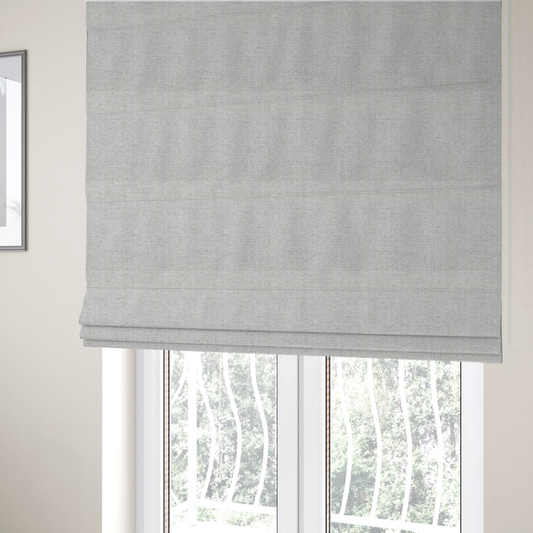 The fabric used to create these Roman blinds is a marl grey woven fabric with a heathered, multi-tonal textured finish.