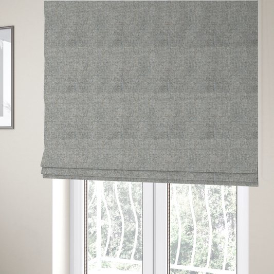 The fabric used to create these Roman blinds is a ash brown woven fabric with a multi-tonal, heathered texture.