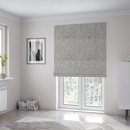 The fabric used to create these Roman blinds is a ash brown woven fabric with a multi-tonal, heathered texture.