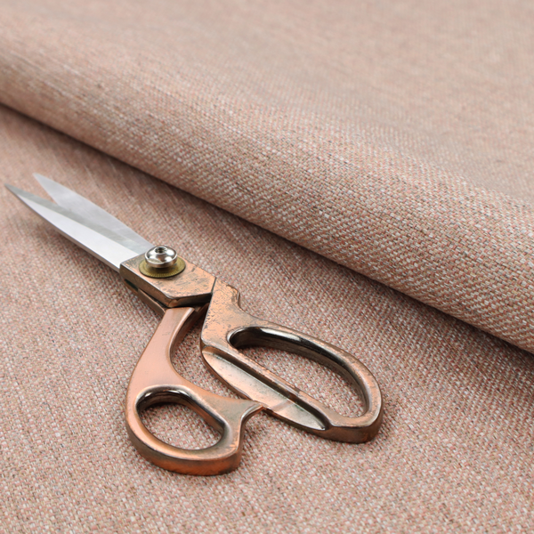A terracotta orange woven fabric with a multi-tonal, heathered texture.