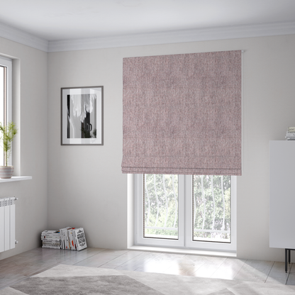 The fabric used to create these Roman blinds is a dusty rose woven fabric with a multi-tonal, heathered texture.