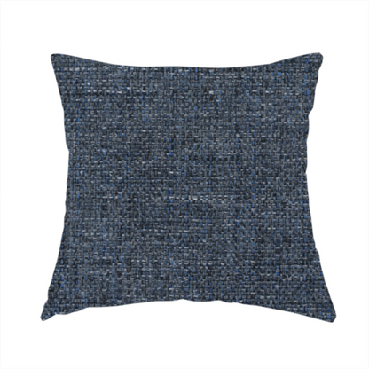 The fabric used to create this handmade cushion is a navy blue woven fabric with a multi-tonal, heathered texture.